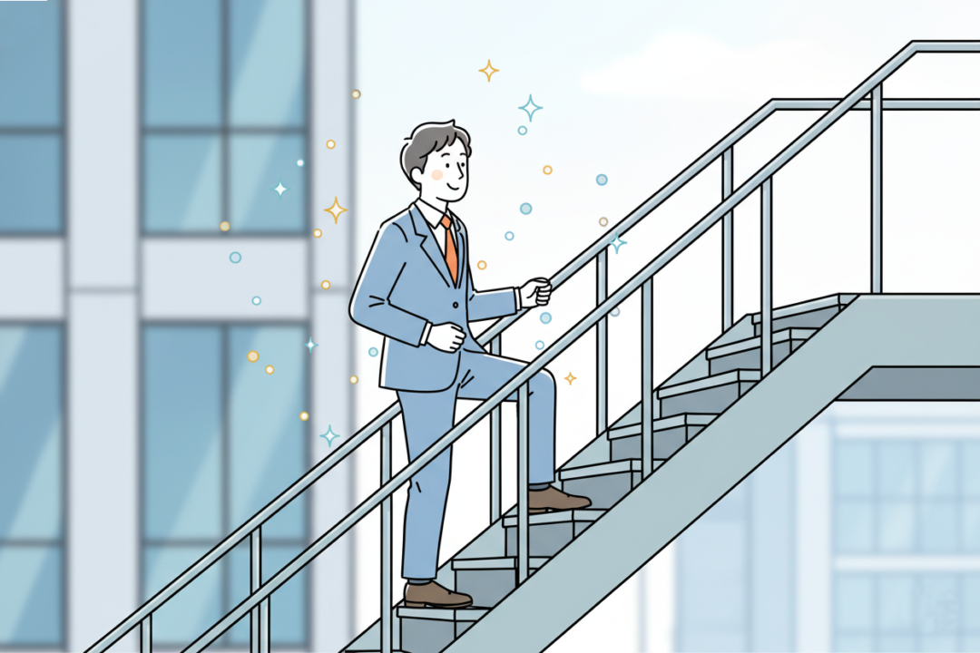 会社の階段を1階分だけ楽しそうに上るビジネスパーソン。
